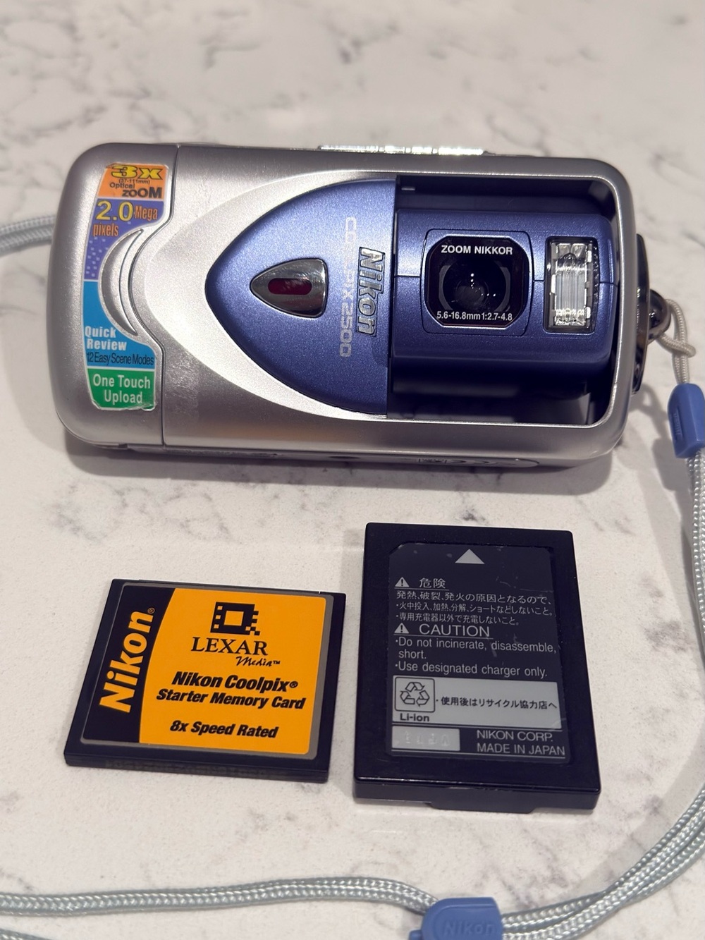Nikon Coolpix Digital Camera in Silver and Blue with Accessories Untested